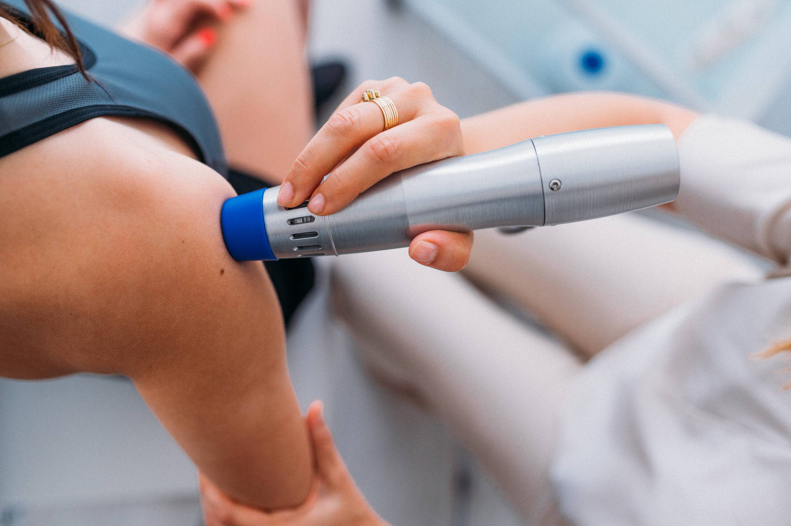 Treating patient's shoulder with wave therapy
